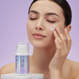 Woman applying cream to her face with a bottle of 'Style Fox' Calm Balm on a purple background